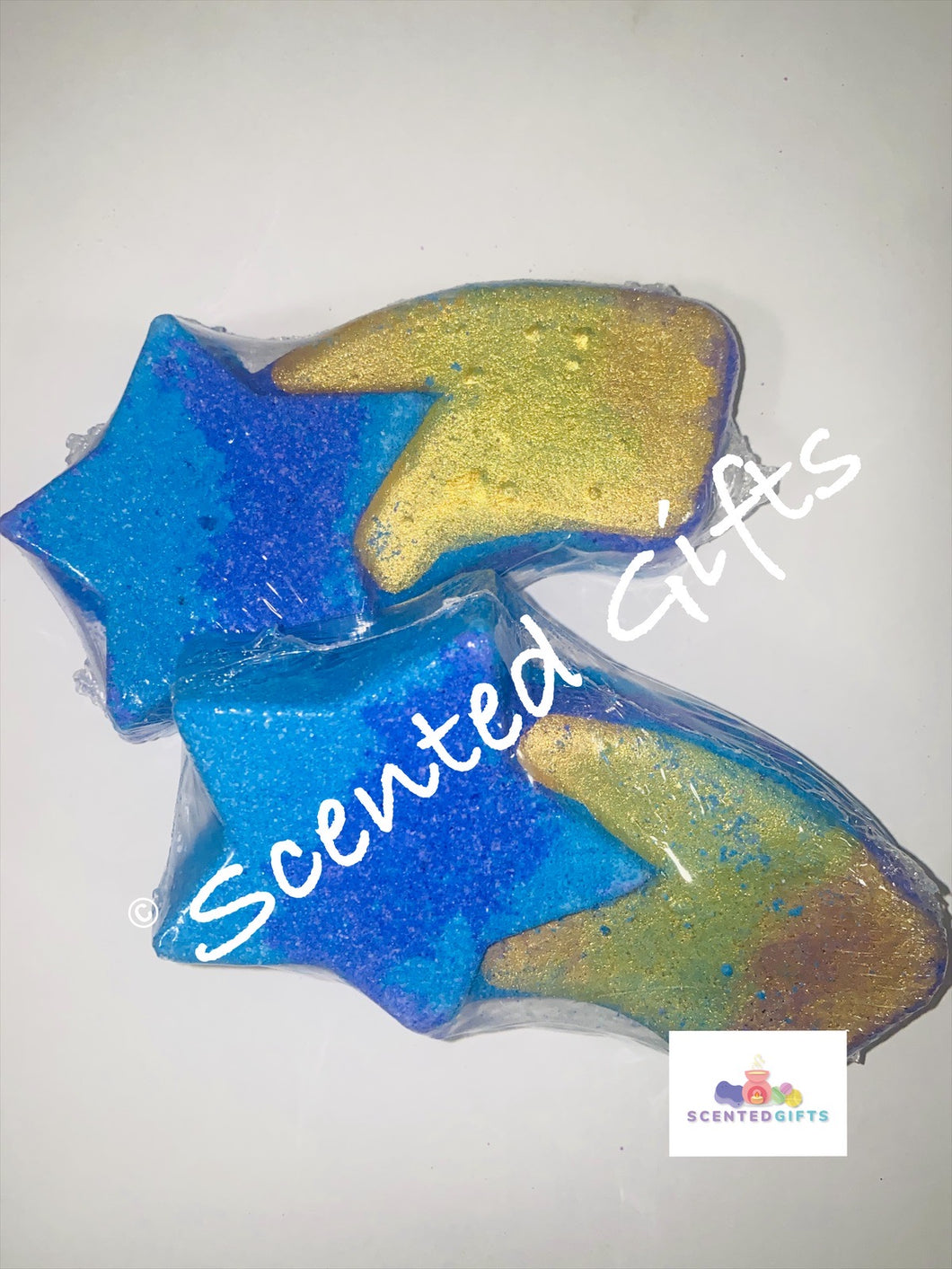 Shooting Star bath bomb  A Shooting Star shaped bath bomb with purple and blue layered colours mica painted detail and scented in showfairy (L**H dUPE).