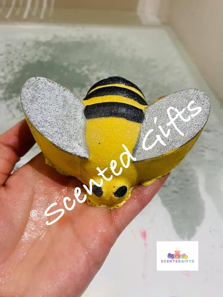 Queen bee bath bomb coloured in black and yellow, a gorgeous vibrant yellow with hidden black fragranced in Thai lime and mango Jo Malone.