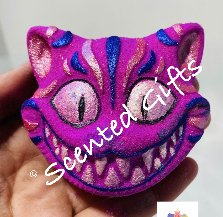 Cheshire Cat bath bomb  One of our favourite characters, fragranced in bubblegum. Coloured in pink with hand painted mica detail.