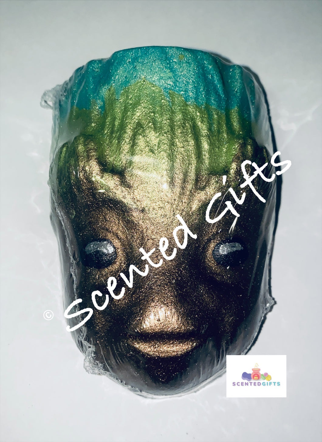 Galaxy Groot Boy bath bomb Groot shaped bath bomb airbrushed in brown and ombre greens with blue coloured embeds, Scented in green apple.