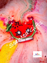 Load image into Gallery viewer, Maggie Melon bath bomb  A gorgeous red coloured melon fun shaped bath bomb with mica detail and scented in CHERRY LIME. 
