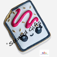 Load image into Gallery viewer, Pop Tart Bath Bomb  A pop tart shaped bath bomb with hand painted detail and hidden embeds scented in rouge (perfume dupe). 
