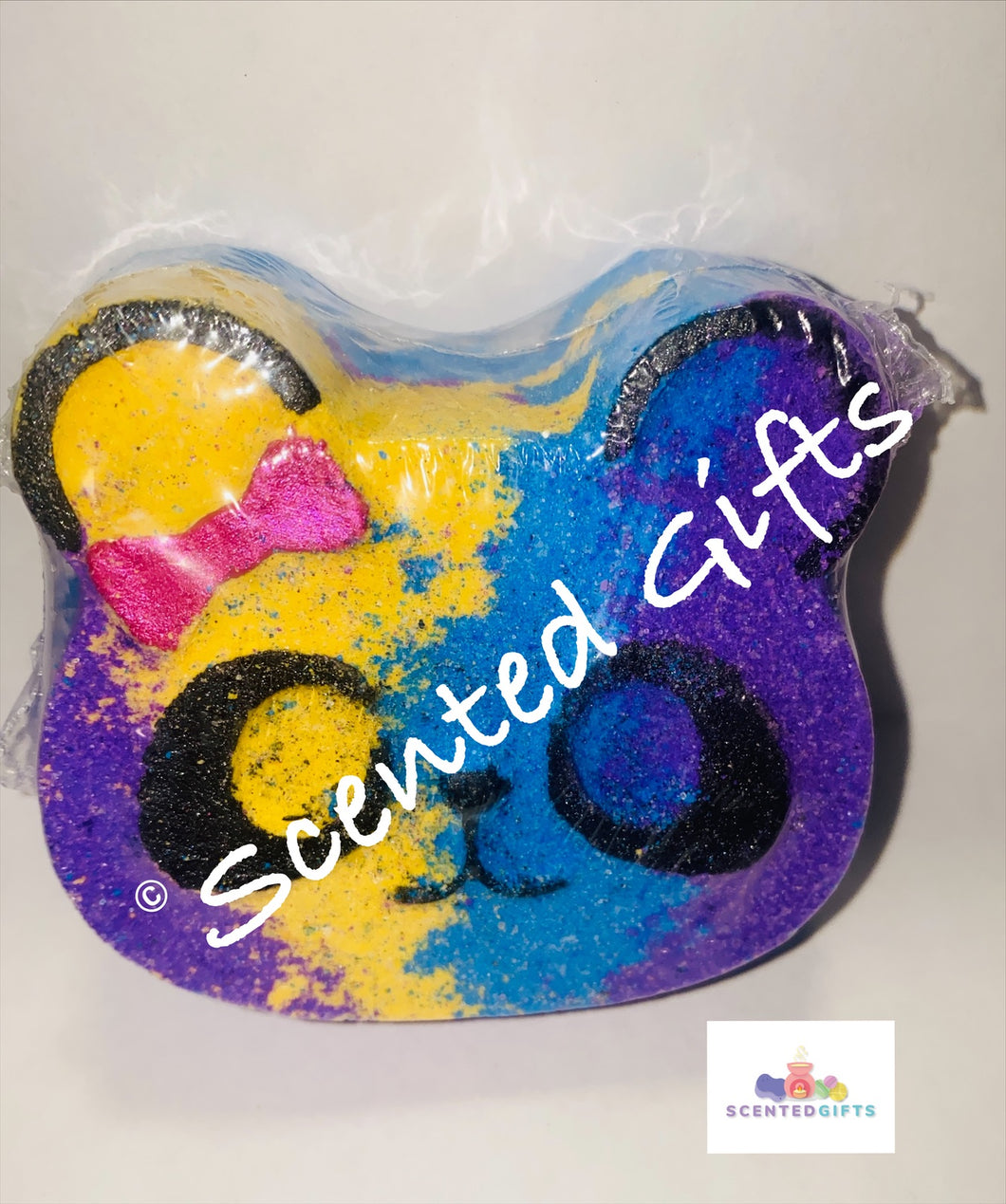 Pansy Panda bath bomb  A pink purple yellow and blue layered panda shape bath bomb scented in black raspberry and vanilla. 