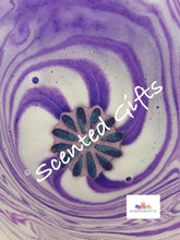 Load image into Gallery viewer, Purple Daisy bath bomb    A purple coloured daisy flower shaped bath bomb with coloured hidden embeds and scented in bedtime bath.  
