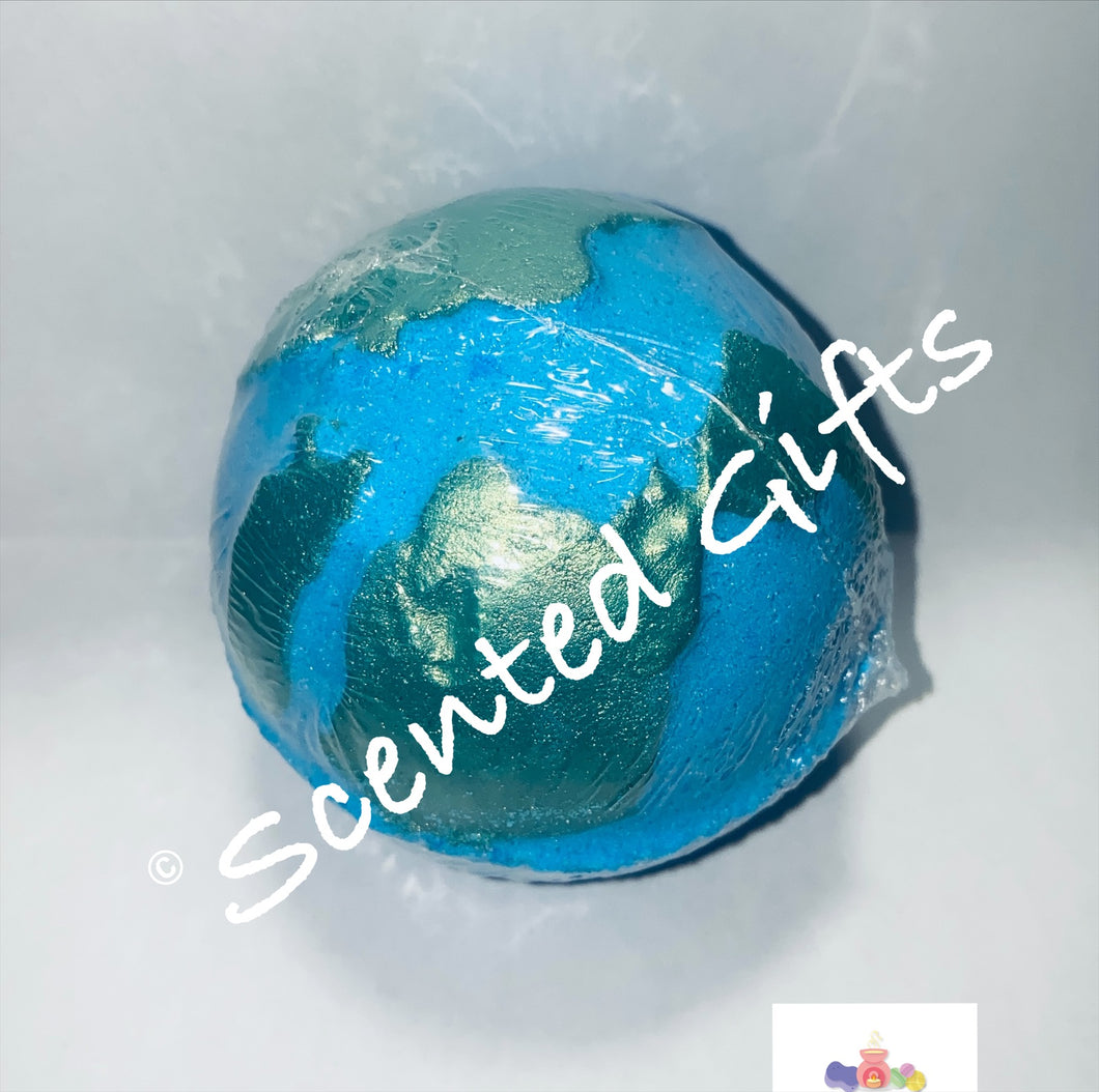 Planet Earth Bath Bomb  A round planet earth sphere shaped blue bath bomb with green mica detail scented in baby powder. 