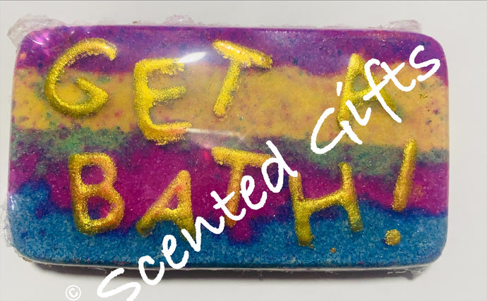 Get a bath’ bath bomb  A multi colours layered rectangular bath bomb with lettered writing ‘get a bath’ scented in candy hearts.     