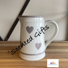 Load image into Gallery viewer, A beautiful and classic ceramic jug with a washed grey heart pattern.  A must have for displaying your favourite blooms and for showcasing on your table and in the home.  Dimensions are 11.00 (W) x 16.00 (H) x 15.00 (L) cm  
