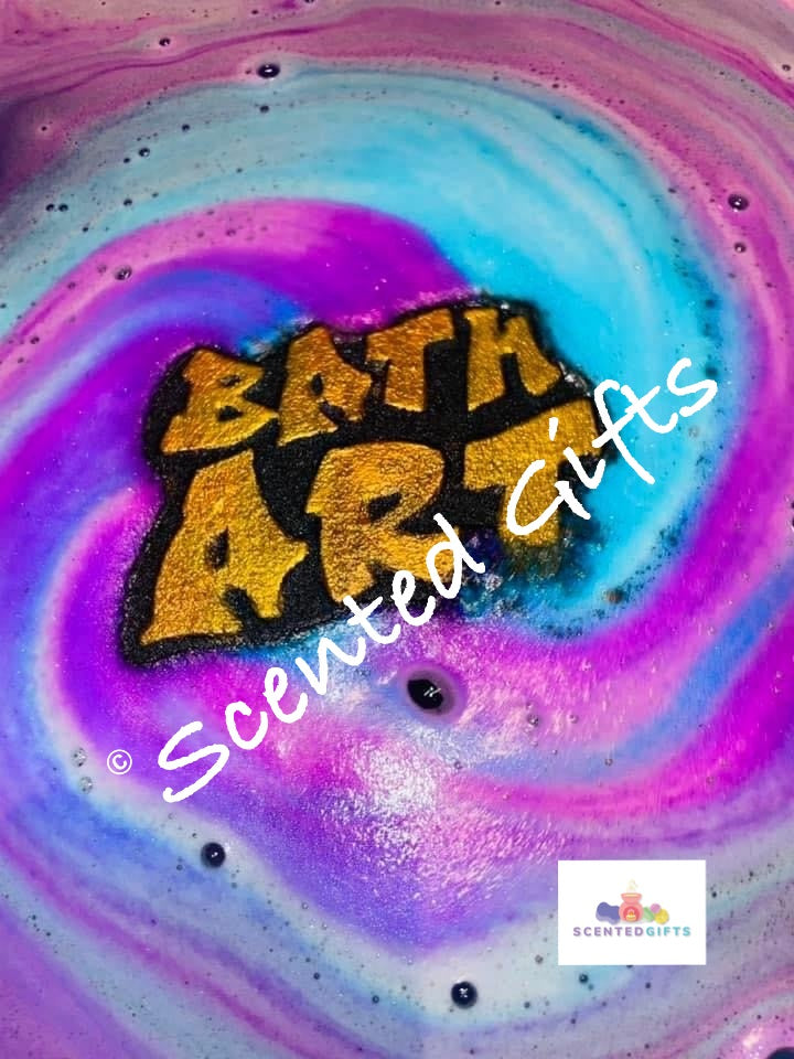 Bath Art bath bomb   A black coloured Bath art shaped bath bomb with gold mica writing detail and hidden embeds scented in enchantment. 