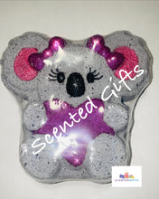 Load image into Gallery viewer, Kylie Koala Bath Bomb    A grey koala bomb with hidden pink, purple and yellow centre. Fragranced in joyous
