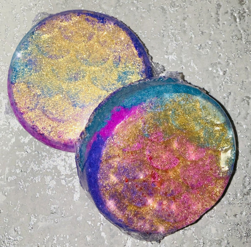 Sparkly Mermaid Waters bath bomb scented in JPG her coloured in teal, pink, purple and painted in gold mica shimmer dust.