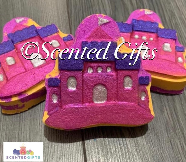 Princess Sandcastle bath bomb scented in Thai lime and mango and coloured in pink and orange with a hand painted castle detail.