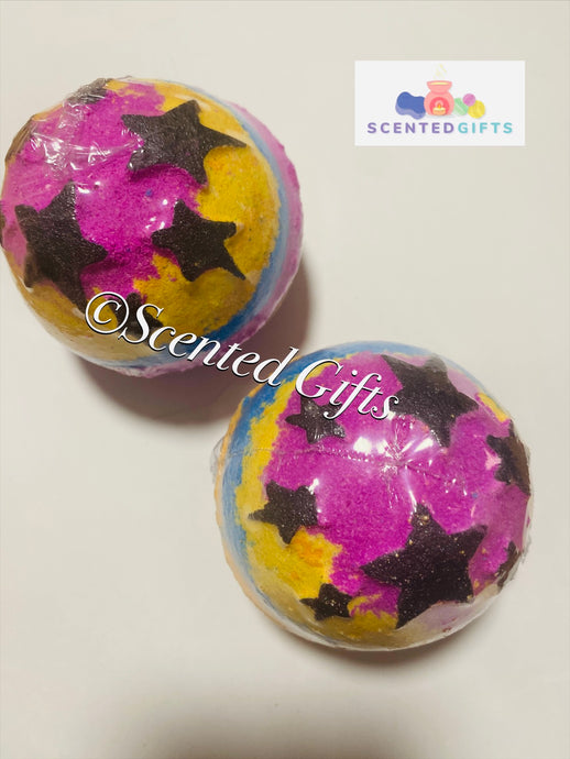 Star Jumbo Rainbow bath bomb scented in Love spell. coloured in pink, yellow and blue with black stars.